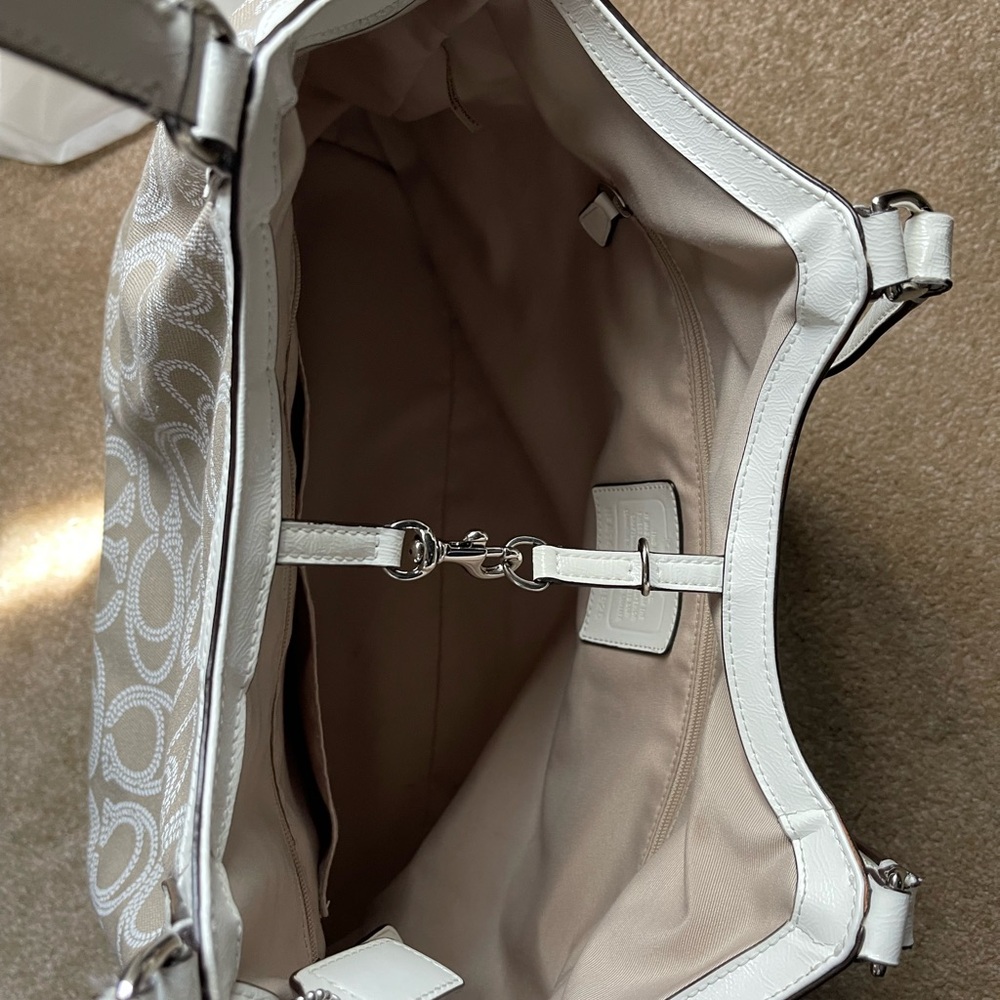 Lovely Coach purse. Excellent condition. LGE sz. Taupe canvas white leather trim